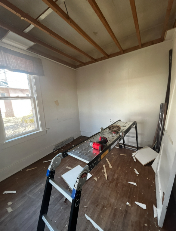 Ceiling stripped back to bare joists ready for new drywall