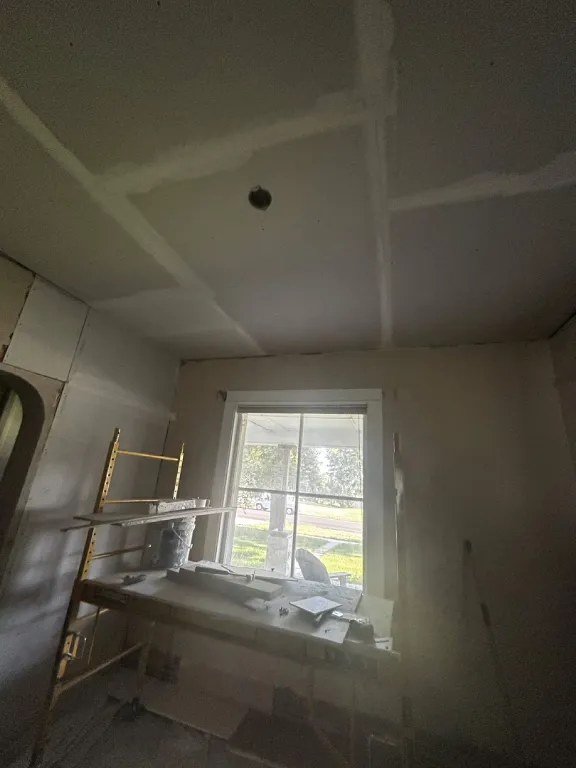New drywall ceiling with taped and mudded seams