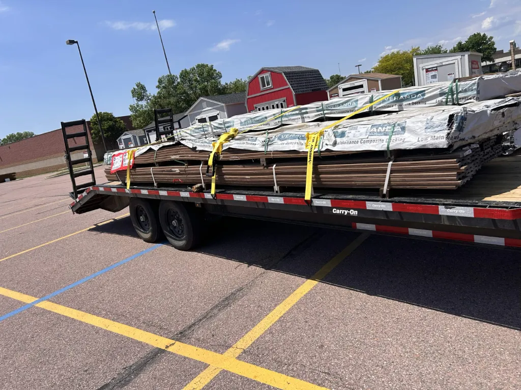 Bundles of composite decking boards on a trailer