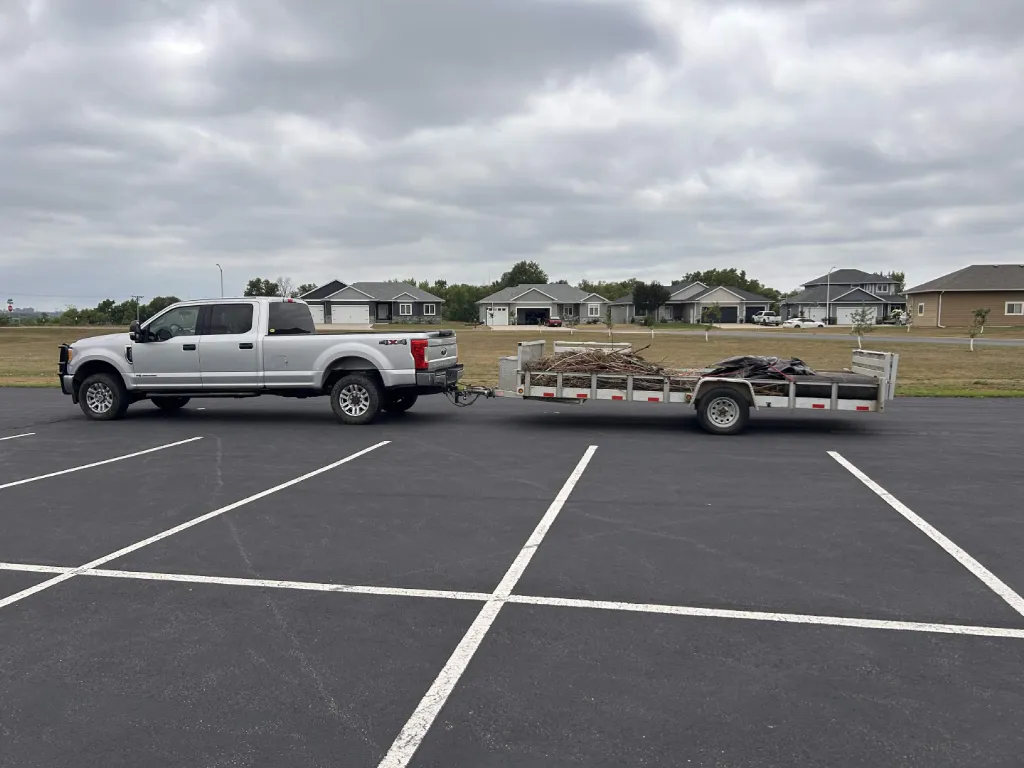 Trailer loaded with brush, dirt and junk for the landfill