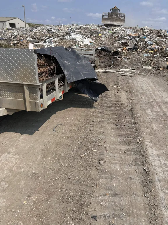 Trailer unloading at the landfill debris pile