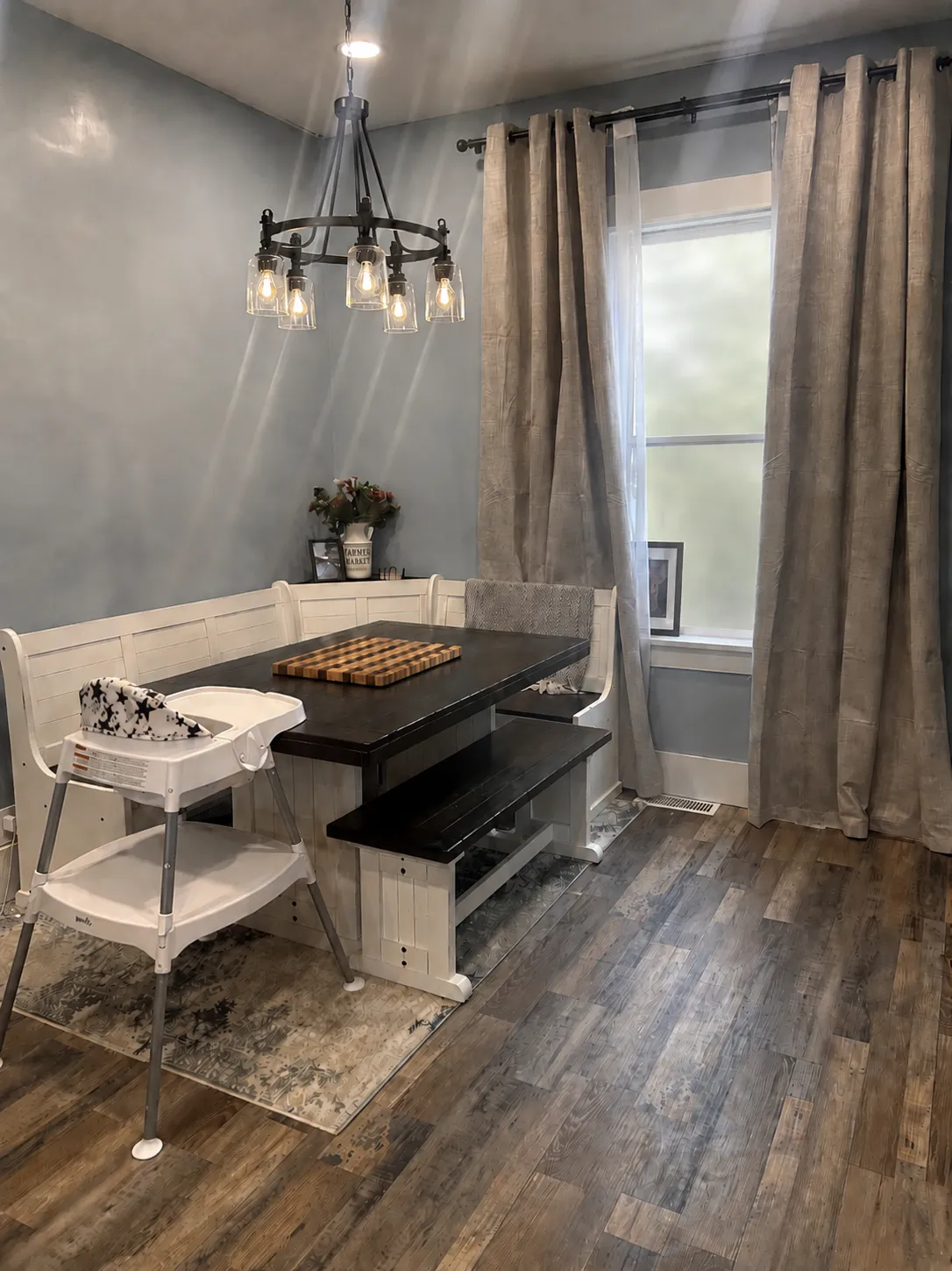 Dining nook with new plank flooring and trim