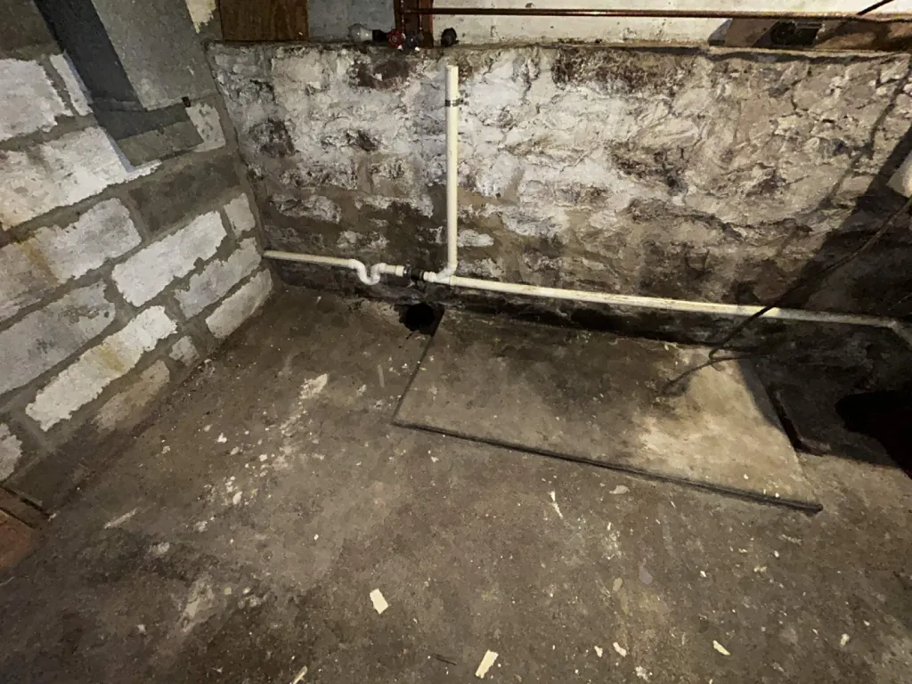 Basement stone foundation corner before the platform was built