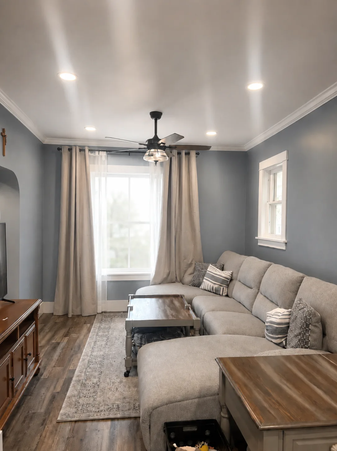 Finished living room with dark plank flooring