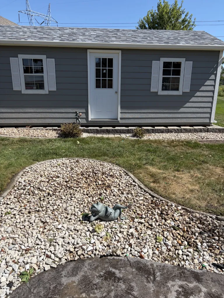 Finished rock beds with the overgrown shrubs gone