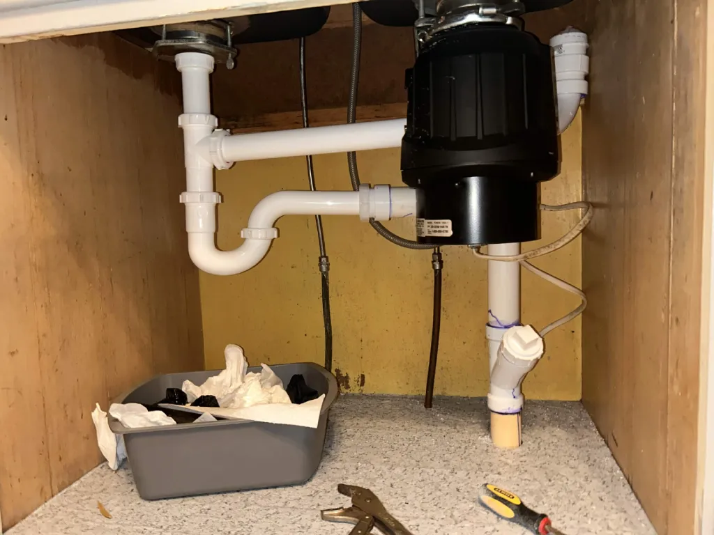 New PVC trap and drain fitted under the sink