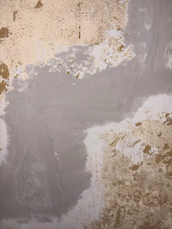 Patching compound skim-coated over the old texture
