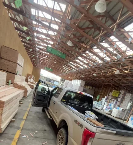 Pickup truck loading material at the lumberyard